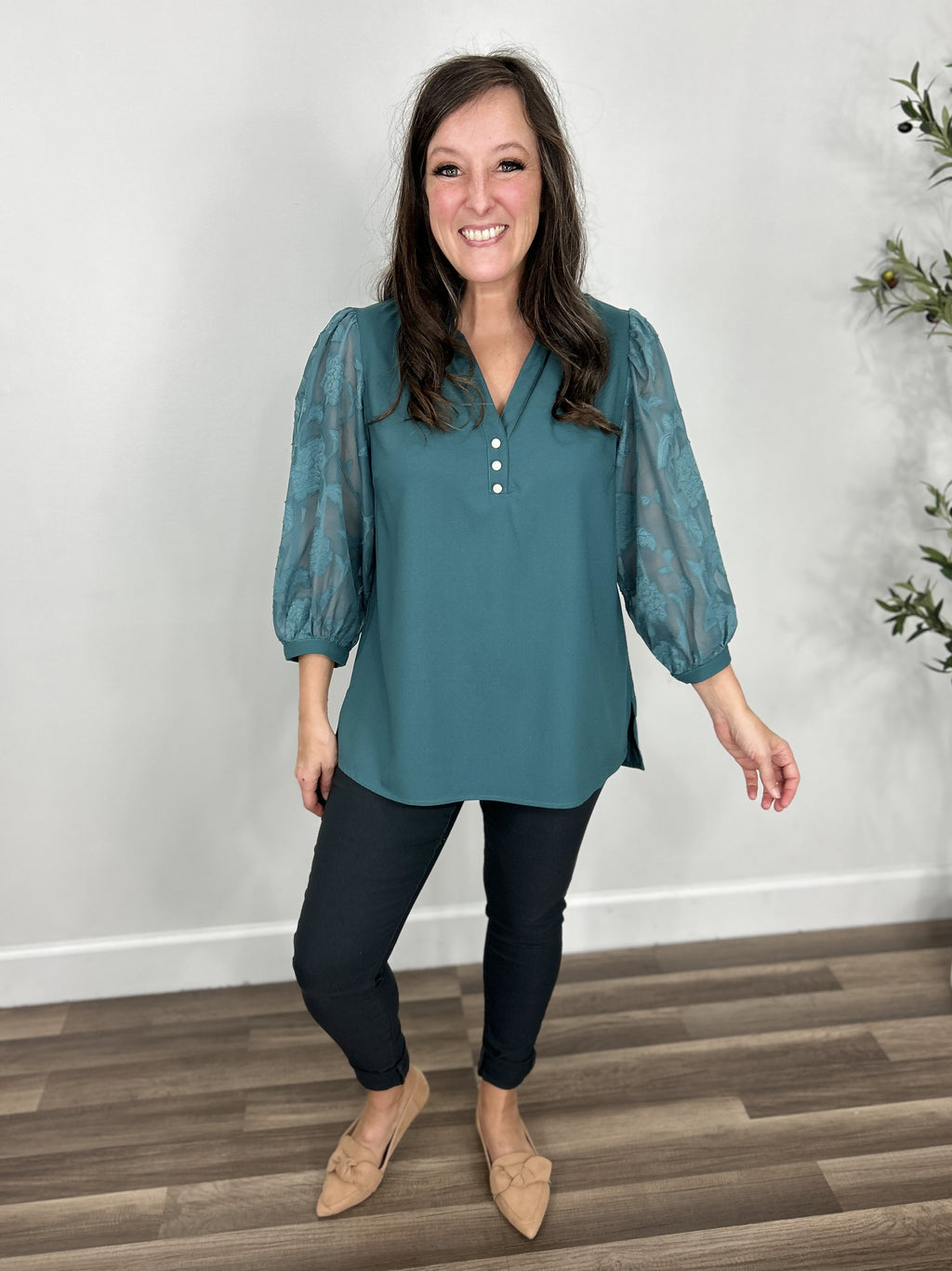 Addison Three Quarter Sheer Sleeve Top styled with charcoal skinny jeans and camel flats.