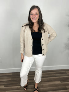 Briggs u-v neckline tank in black layered with a taupe cardigan and white pants for well styled outfit.