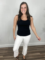 Load image into Gallery viewer, Briggs black tank round neckline paired with white ankle pants and wedged heels.
