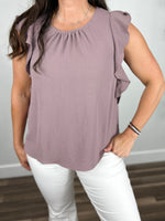 Load image into Gallery viewer, Upclose view of the purple round neck, ruffle cap sleeve capri top.
