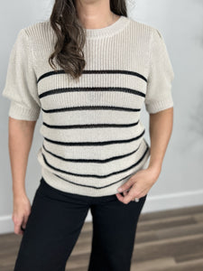 Upclose view of the taupe and horizontal stripes of the Carrie striped knit sweater top.