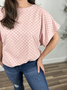Claire checker dolman sleeve top upclose view of two tone pink pattern.