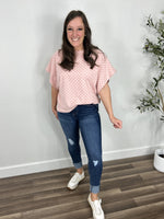 Load image into Gallery viewer, Two tone pink checker women&#39;s top paired with blue jeans and sneakers.
