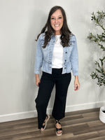 Load image into Gallery viewer, Women&#39;s Emma Peplum Lightweight denim jacket layered with a white tee shirt and black denim pants.
