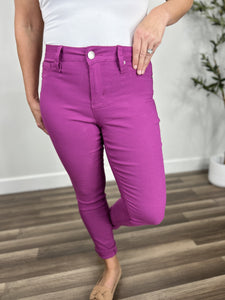 Upclose view of button fly and belt loops on the Fletcher Stretch Skinny Pants in Berry.