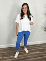Load image into Gallery viewer, Fletcher hyperstretch skinny pants in blue paired with a oversized elevated white basic tee and white sneakers.
