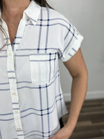 Load image into Gallery viewer, Upclose view of the blue and white Franklin button down top with front chest pocket and button detailing.
