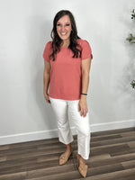 Load image into Gallery viewer, Women&#39;s coral color round neck short sleeve top paired with white crop flare pants and flat shoes.
