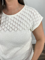 Load image into Gallery viewer, Detailed view of the off white gracelynn cap sleeve sweater top showing off the eyelet yoke.
