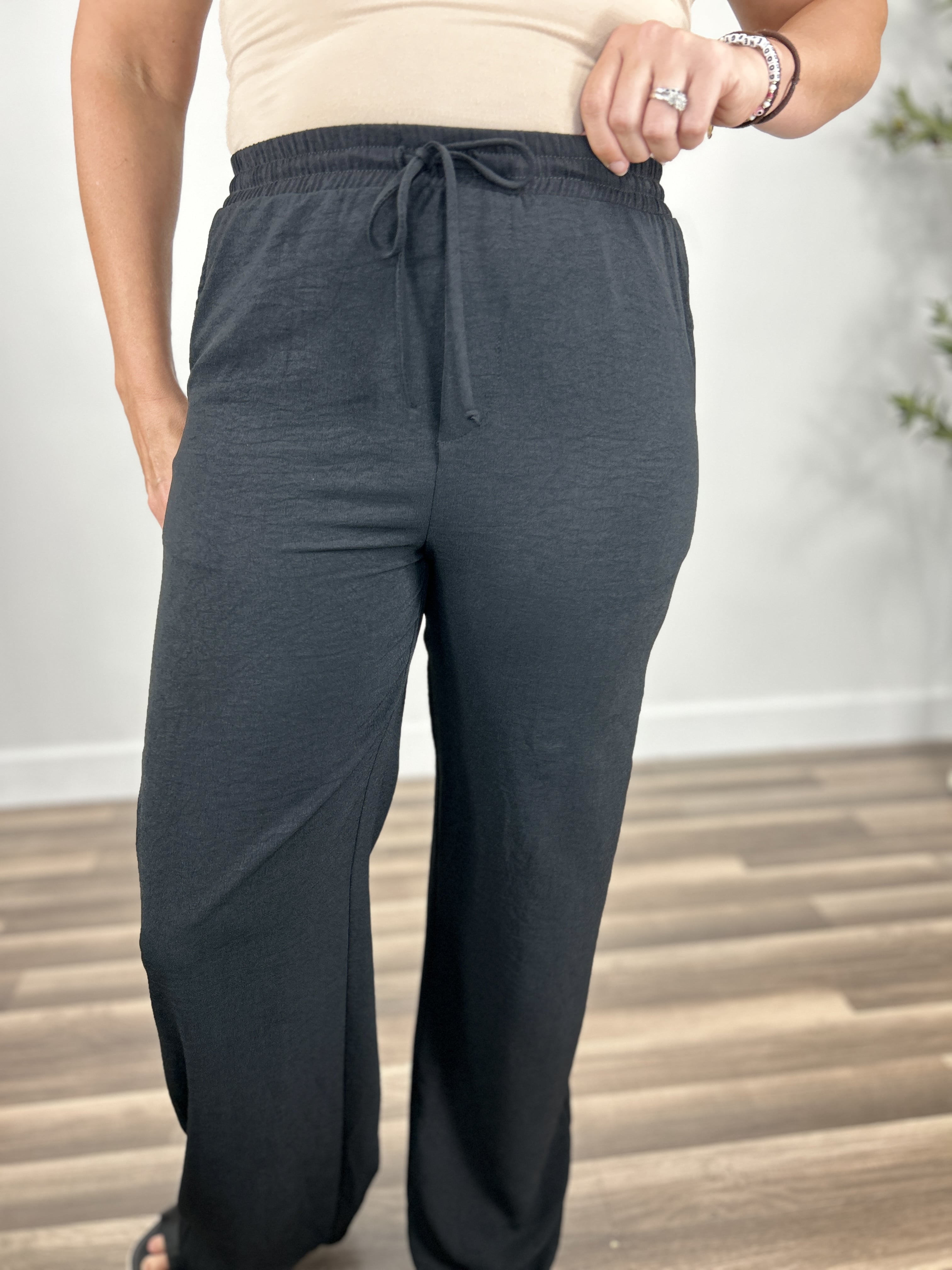 Upclose view of the black elastic waist dress pants for women.