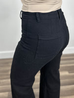 Load image into Gallery viewer, Murphy stretch wide leg pant in black back pocket view.
