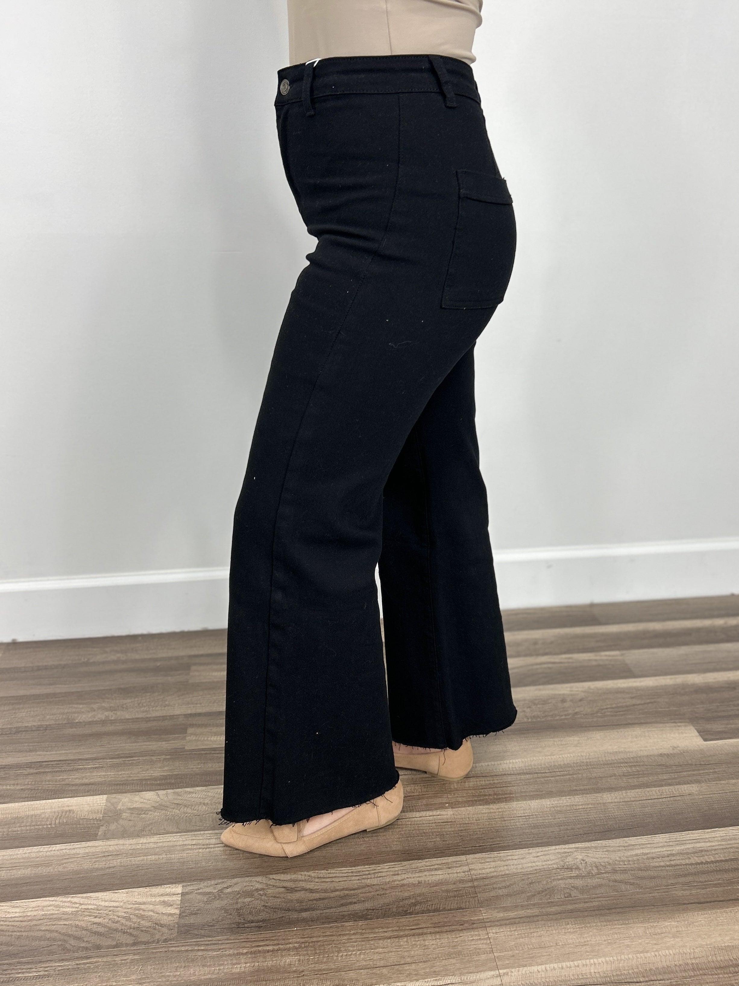 Black wide leg stretchy cropped denim side view.