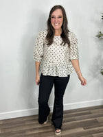 Load image into Gallery viewer, Women&#39;s Black Olivia flare leg jeggings paired with the penny polka dot three quarter sleeve top with black wedge sandals.
