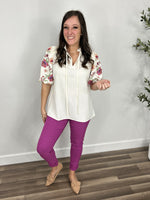 Load image into Gallery viewer, Savannah Floral Puff Sleeve Top paired with the berry color Fletcher Skinny Jeans.
