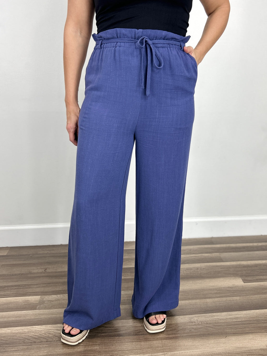 Women's blue linen blend wide leg pant with adjustable waist tie.