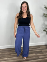 Load image into Gallery viewer, Tate linen wide leg pant styled with a black tank top tucked in.
