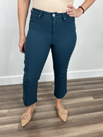 Load image into Gallery viewer, Upclose view of the women&#39;s Wyatt stretch flare crop pants in teal
