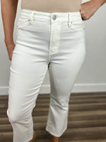 Load image into Gallery viewer, Upclose view of the button and fly detail on the Wyatt stretchy cropped flare pants in white.

