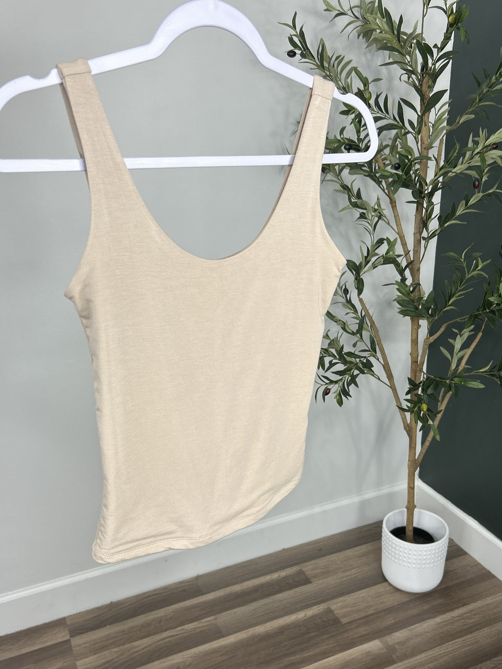 Upclose view of the Renee scoop neck jersey tank in nude. 
